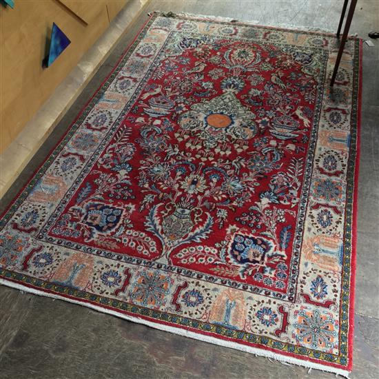 Persian red ground rug(-)